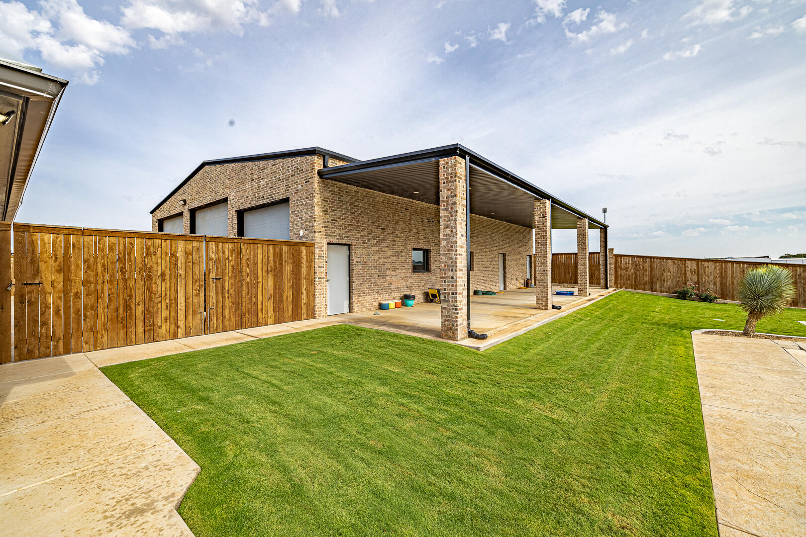 9018 County Road 6850 Lubbock, TX 79407 - Photo 98 of 103 a front view of a house with a yard