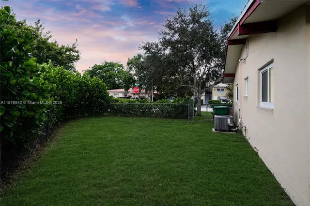 a backyard of a house with lots of green space