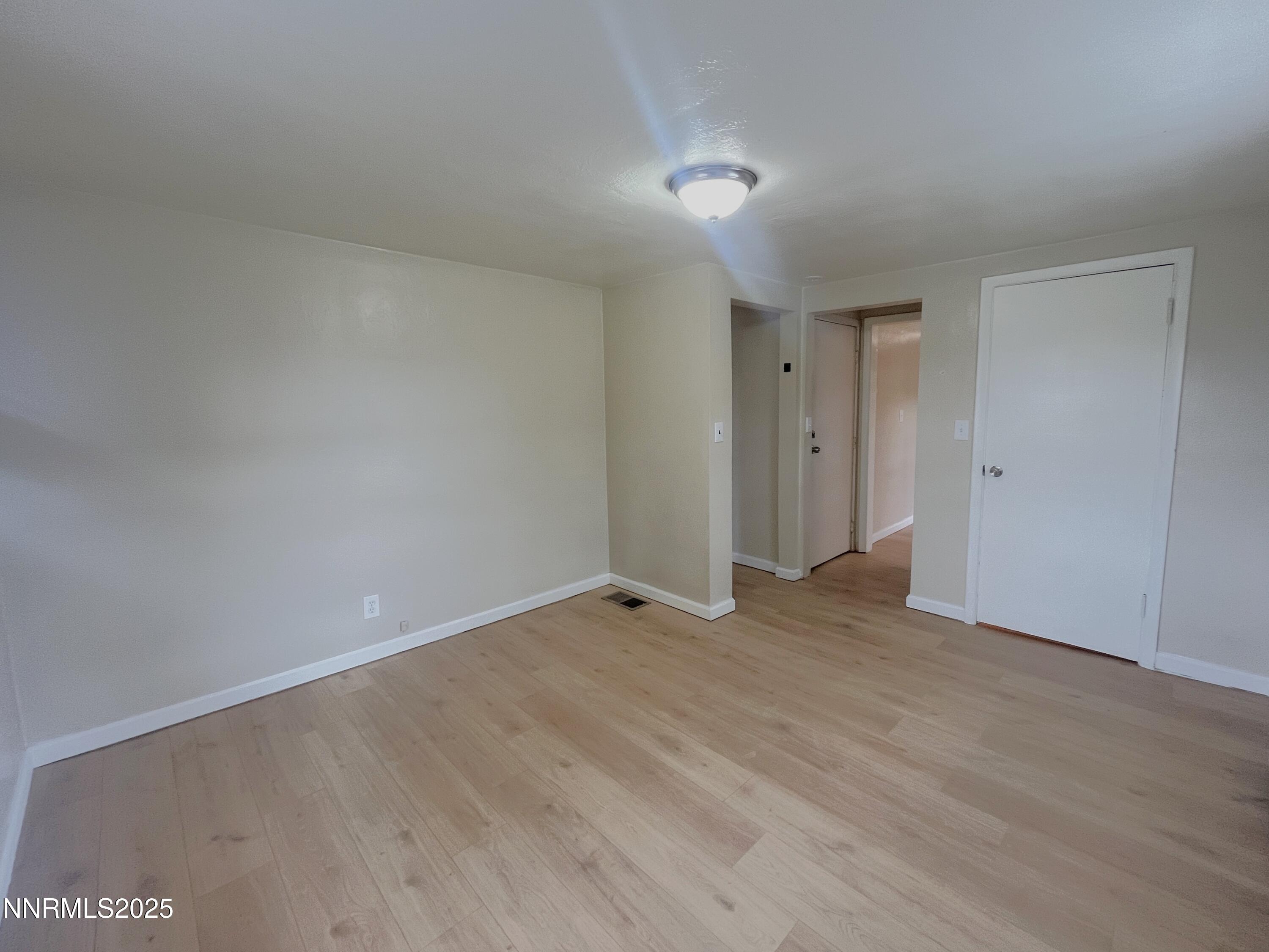 1539 G. Street, Unit C Sparks, NV 89431 - Photo 2 of 6 a view of an empty room with wooden floor