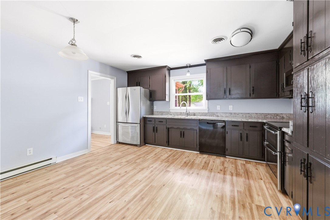 4100 Hidden Valley Road Chester, VA 23831 - Photo 10 of 31 This kitchen, with its eat in area, laminate floor