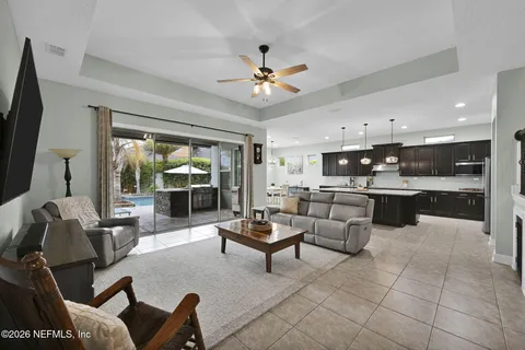 a view of an empty room with a ceiling fan