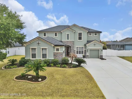 a front view of a house with a garage