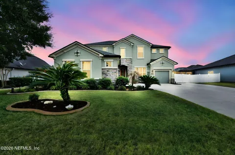 a front view of a house with a outdoor seating space