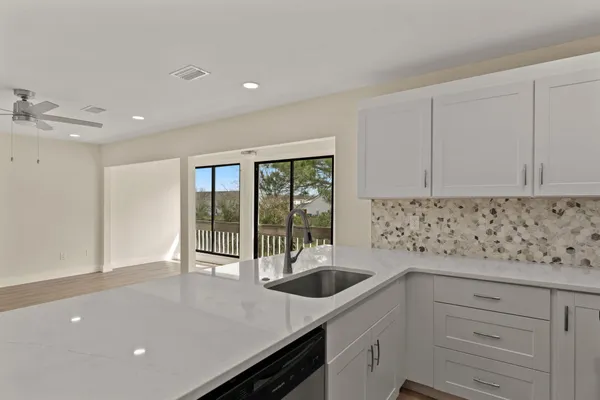 a kitchen with a sink and cabinets