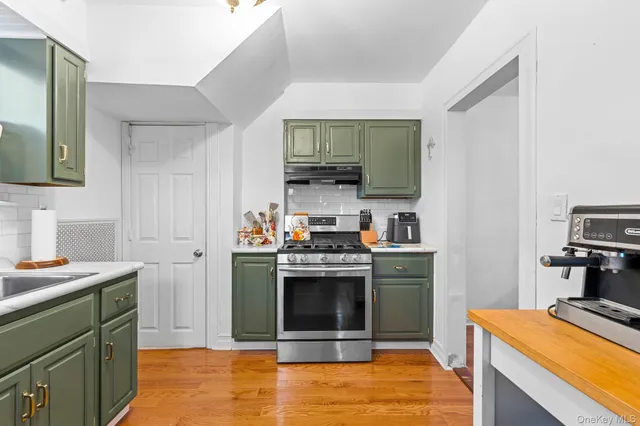 a kitchen with a stove and a sink