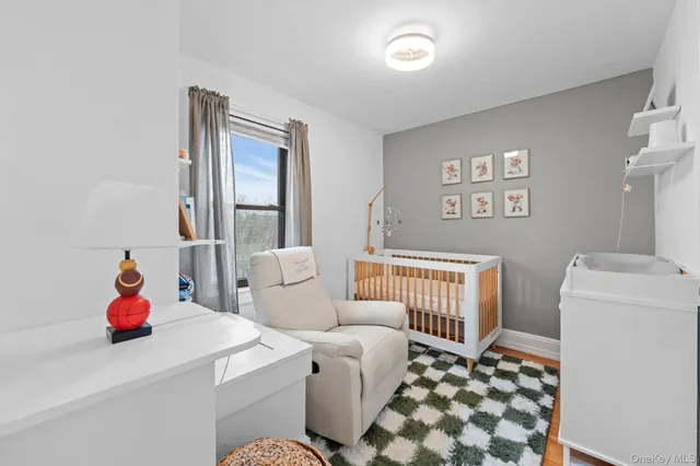 a living room with furniture and next to a window