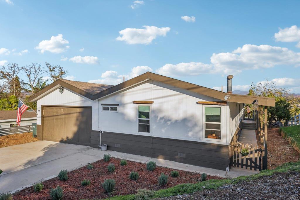 8735 Almond Road Lakeside, CA 92040 - Photo 11 of 71 a view of a house with a yard