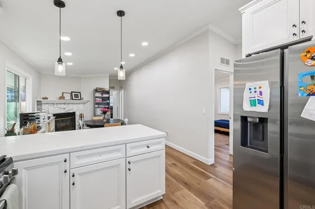 a bedroom with bed and wooden floor