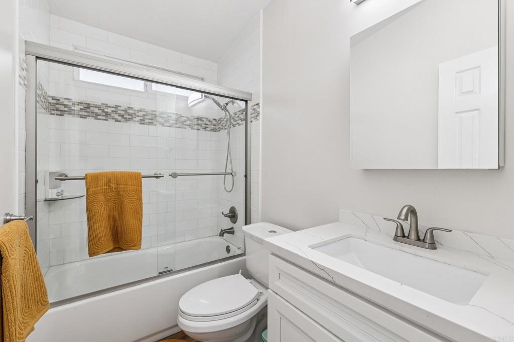 8735 Almond Road Lakeside, CA 92040 - Photo 25 of 71 a bathroom with a sink toilet and shower