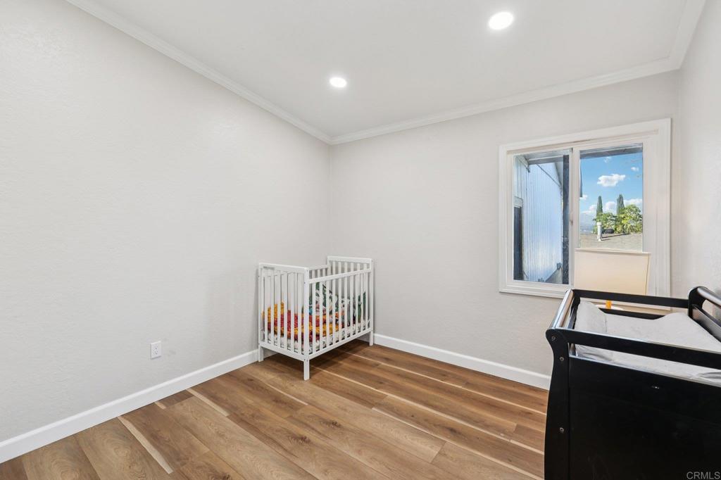 8735 Almond Road Lakeside, CA 92040 - Photo 27 of 71 a view of a room with wooden floor and windows