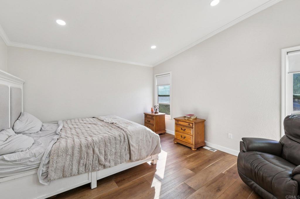 8735 Almond Road Lakeside, CA 92040 - Photo 29 of 71 a bedroom with a bed and couch