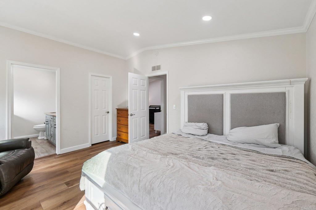 8735 Almond Road Lakeside, CA 92040 - Photo 33 of 71 a bedroom with a bed and a couch