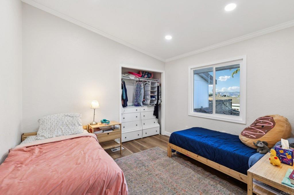 8735 Almond Road Lakeside, CA 92040 - Photo 36 of 71 a bedroom with furniture and a couch