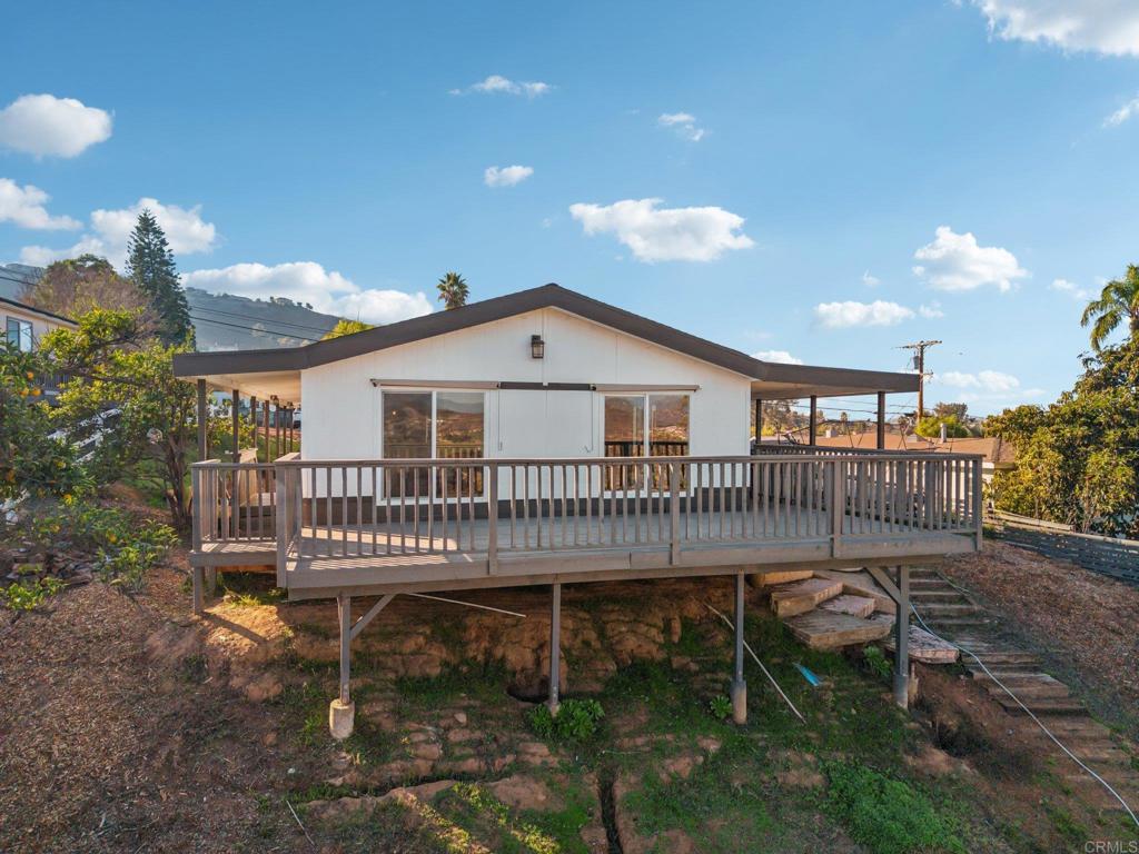 8735 Almond Road Lakeside, CA 92040 - Photo 60 of 71 a view of a house with a deck and a yard