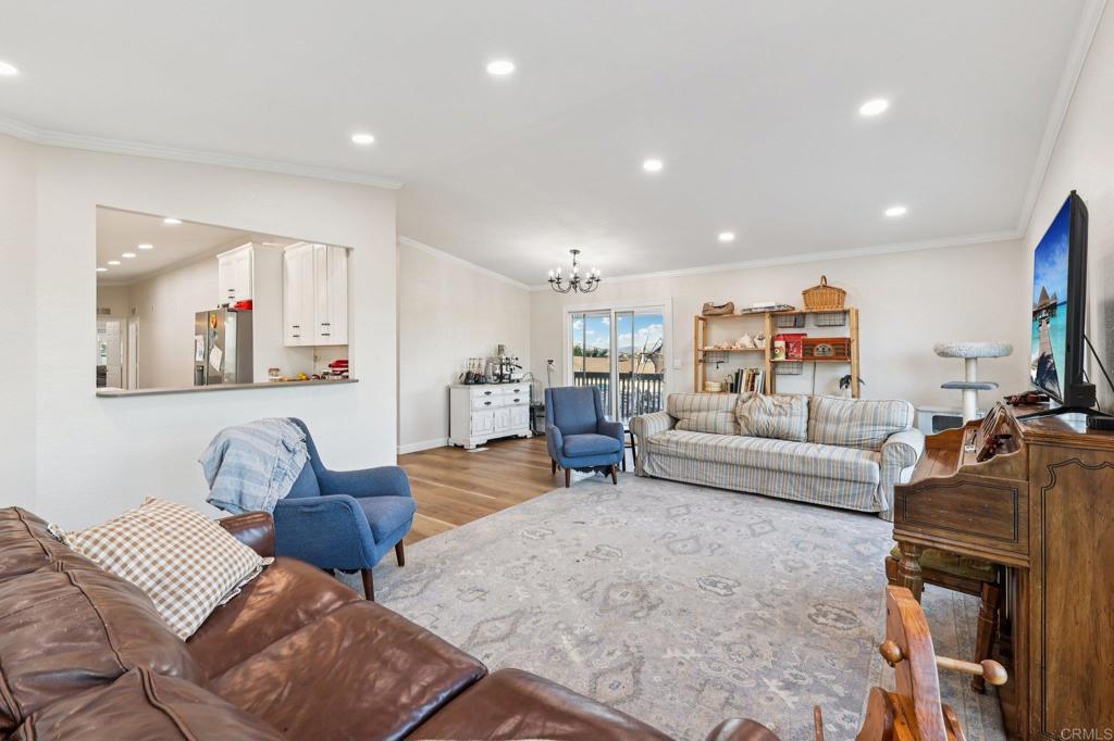 8735 Almond Road Lakeside, CA 92040 - Photo 6 of 71 a living room with furniture and a flat screen tv