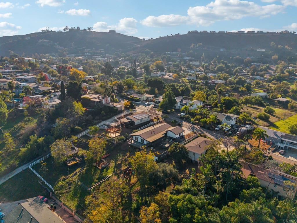 8735 Almond Road Lakeside, CA 92040 - Photo 63 of 71 an aerial view of residential house with parking space and mountain view in back