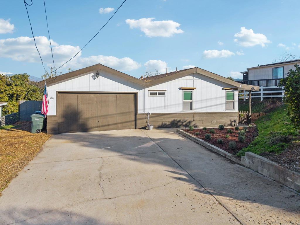 8735 Almond Road Lakeside, CA 92040 - Photo 67 of 71 a front view of a house with yard