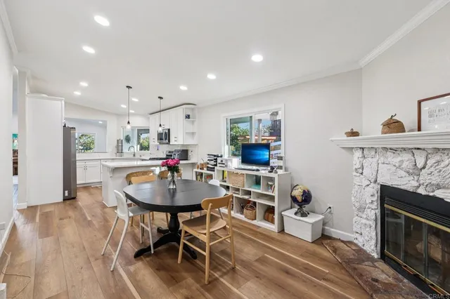 a kitchen with a sink stainless steel appliances and white cabinets