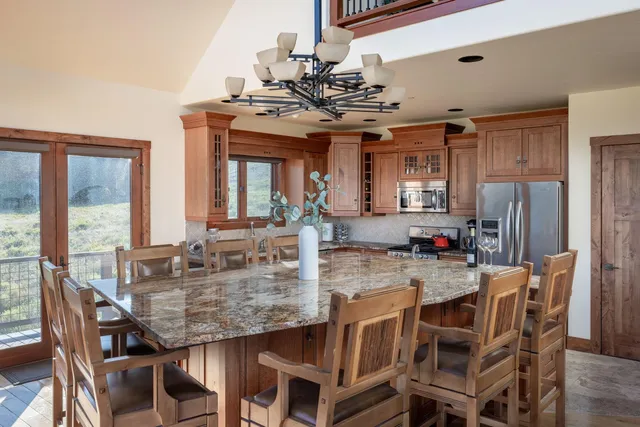 a view of a dining room with furniture and window