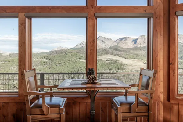 a view of a city from a dining room with large windows