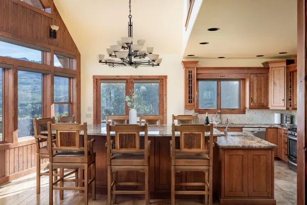 a view of a dining room with furniture large windows and wooden floor