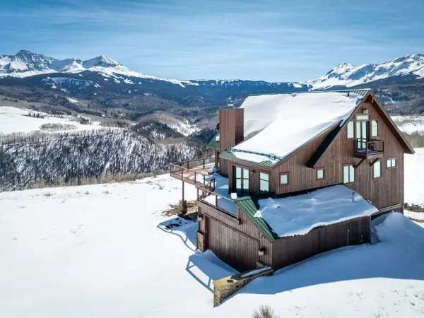 a view of roof deck with mountain view and mountain view