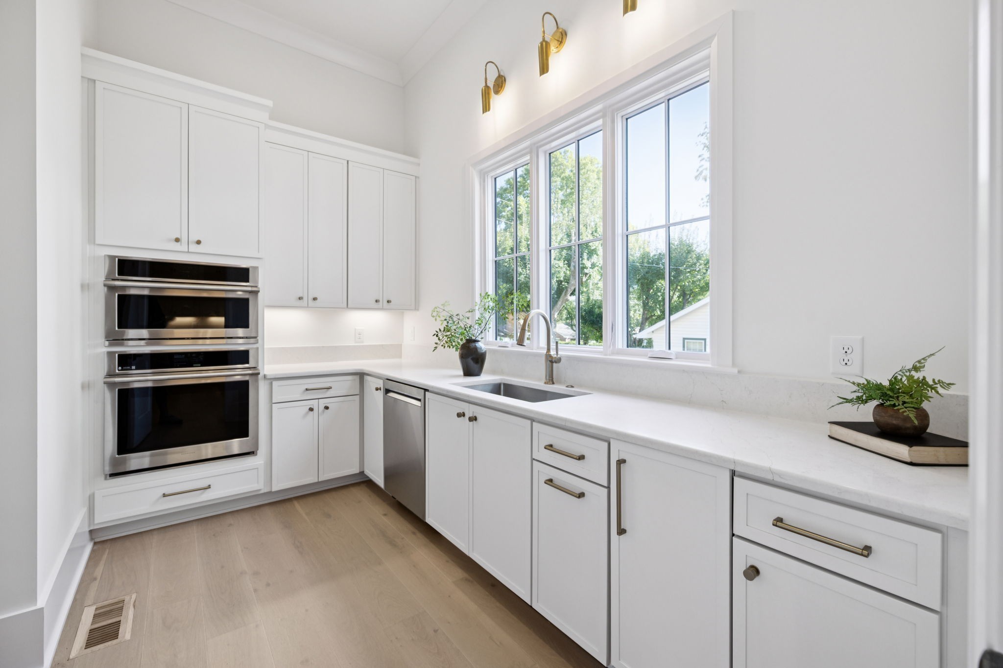 1408 Adams Street Franklin, TN 37064 - Photo 34 of 74 a kitchen with white cabinets and white appliances