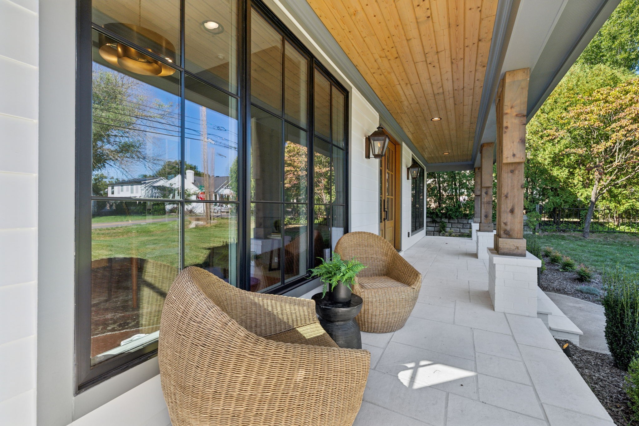 1408 Adams Street Franklin, TN 37064 - Photo 5 of 74 a view of a patio with couches and table and chairs and garden view
