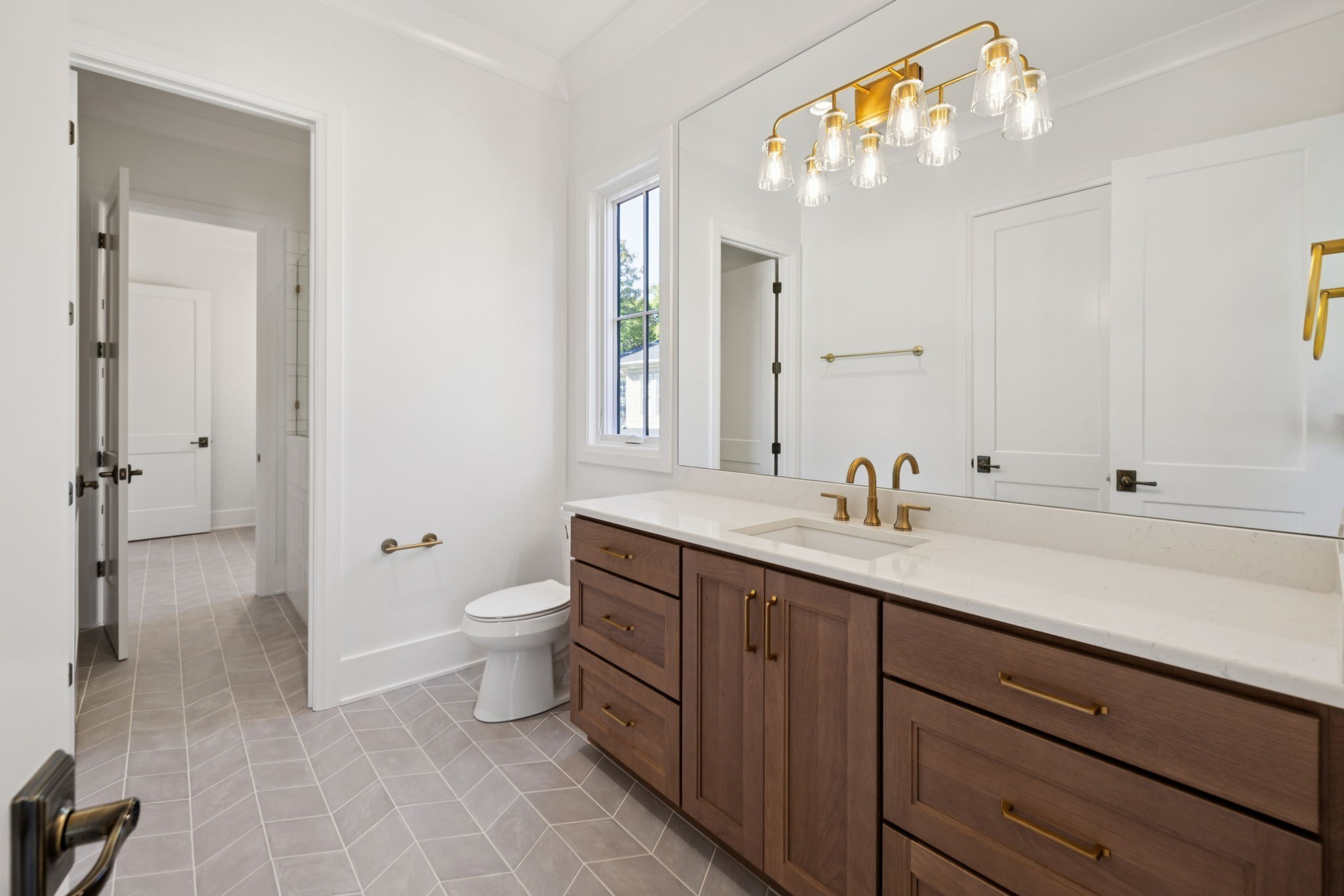 1408 Adams Street Franklin, TN 37064 - Photo 58 of 74 a bathroom with a toilet a sink and mirror