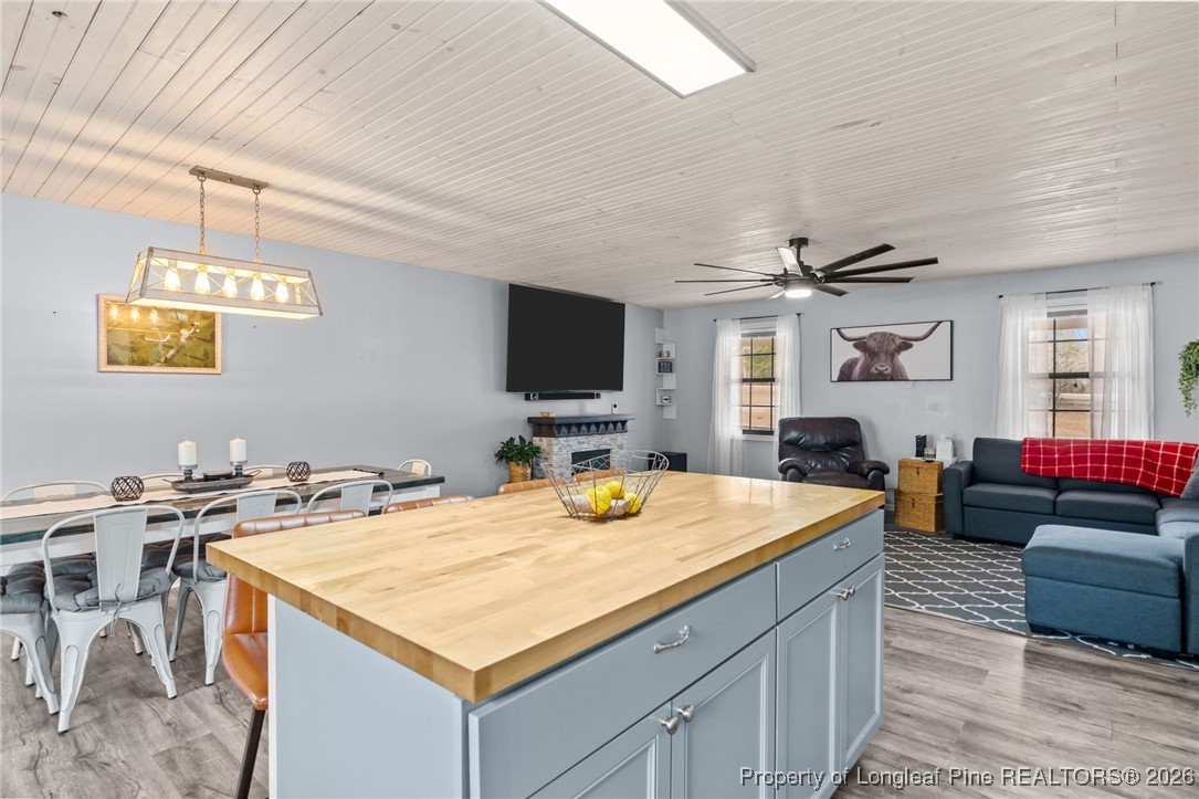 2229 Tingen Road Lillington, NC 27546 - Photo 16 of 50 a room with furniture and flat screen tv