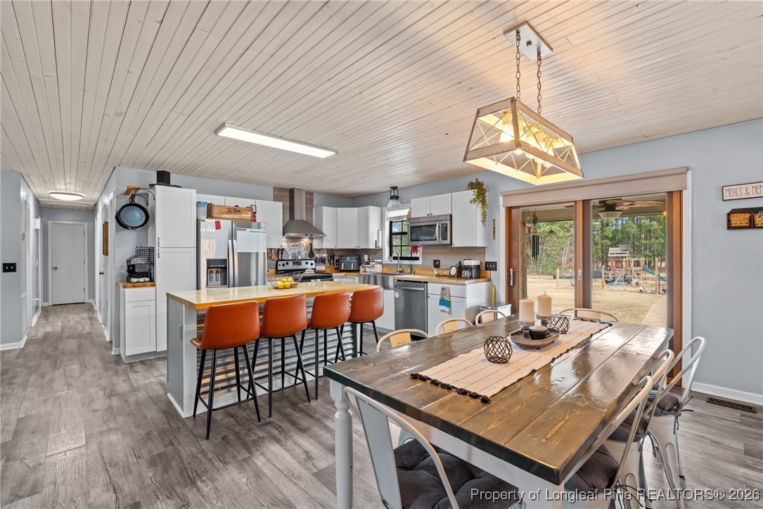 2229 Tingen Road Lillington, NC 27546 - Photo 19 of 50 a living room with dining room and kitchen view