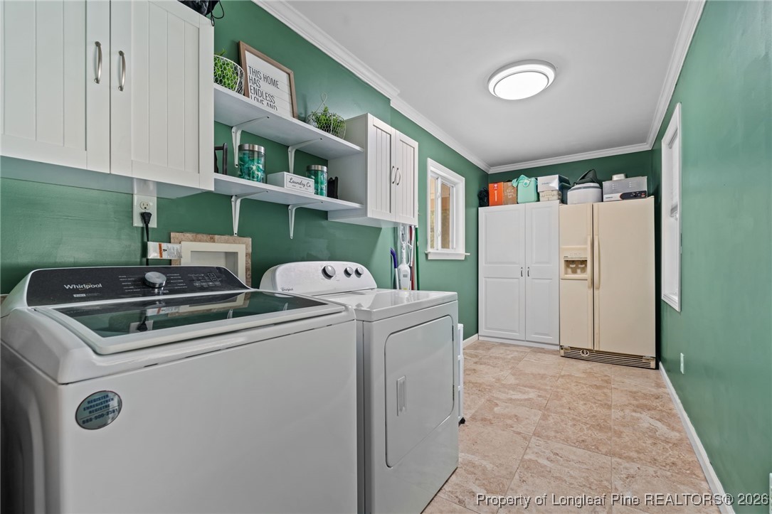 2229 Tingen Road Lillington, NC 27546 - Photo 21 of 50 a utility room with dryer and washer