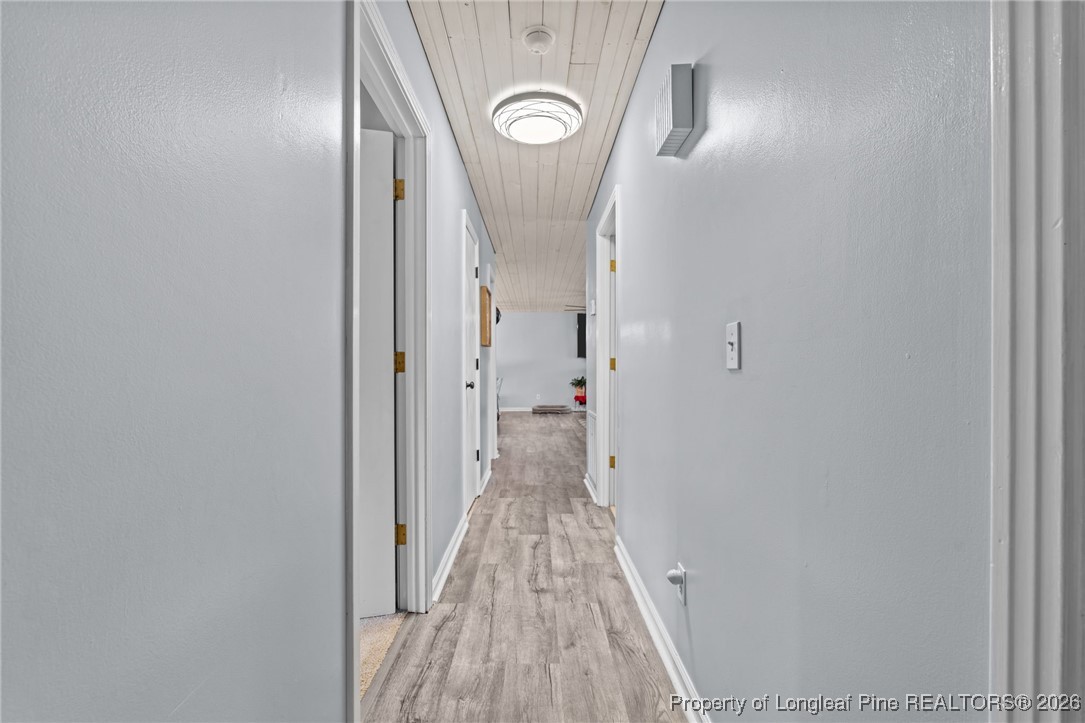 2229 Tingen Road Lillington, NC 27546 - Photo 22 of 50 a view of a hallway with wooden floor