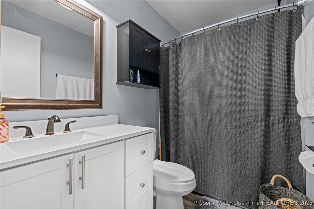 2229 Tingen Road Lillington, NC 27546 - Photo 27 of 50 a bathroom with a sink and a mirror