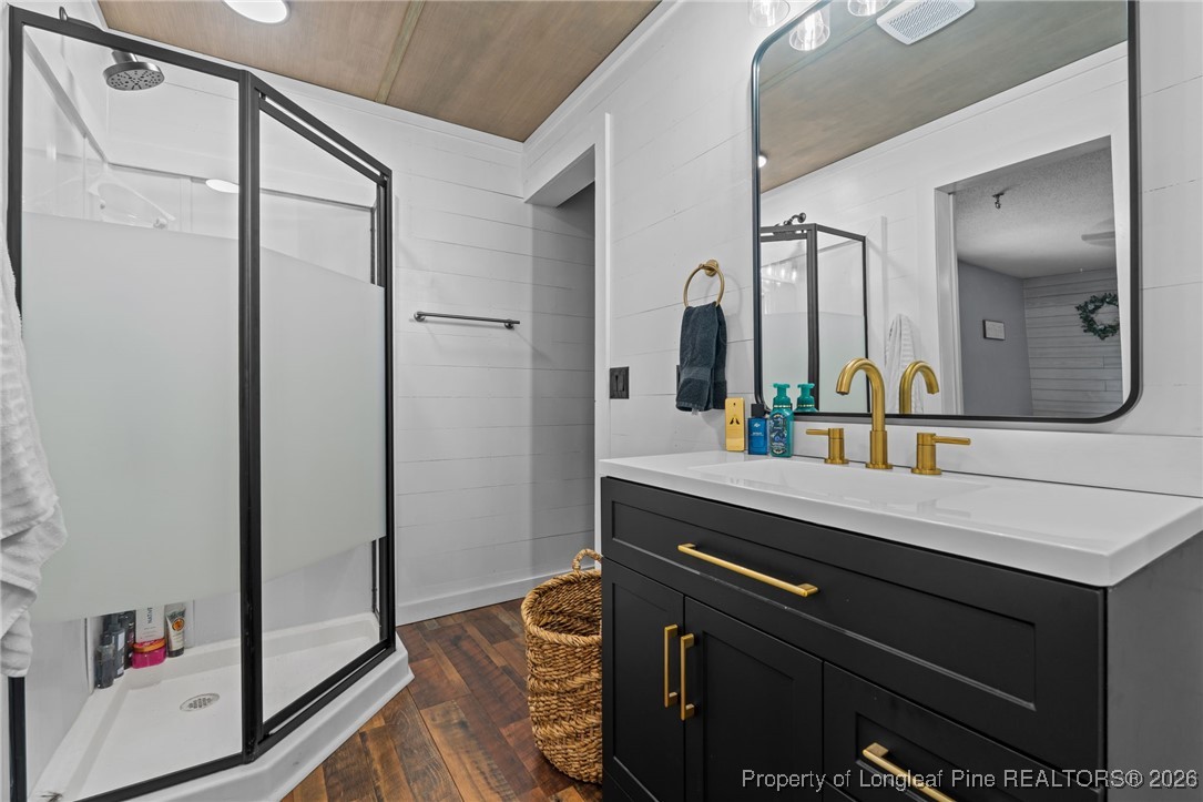 2229 Tingen Road Lillington, NC 27546 - Photo 28 of 50 a bathroom with a sink and a mirror