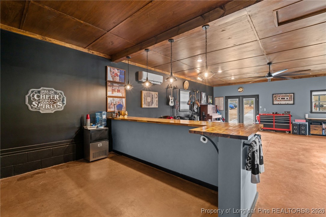 2229 Tingen Road Lillington, NC 27546 - Photo 37 of 50 a room with lots of furniture and clutter