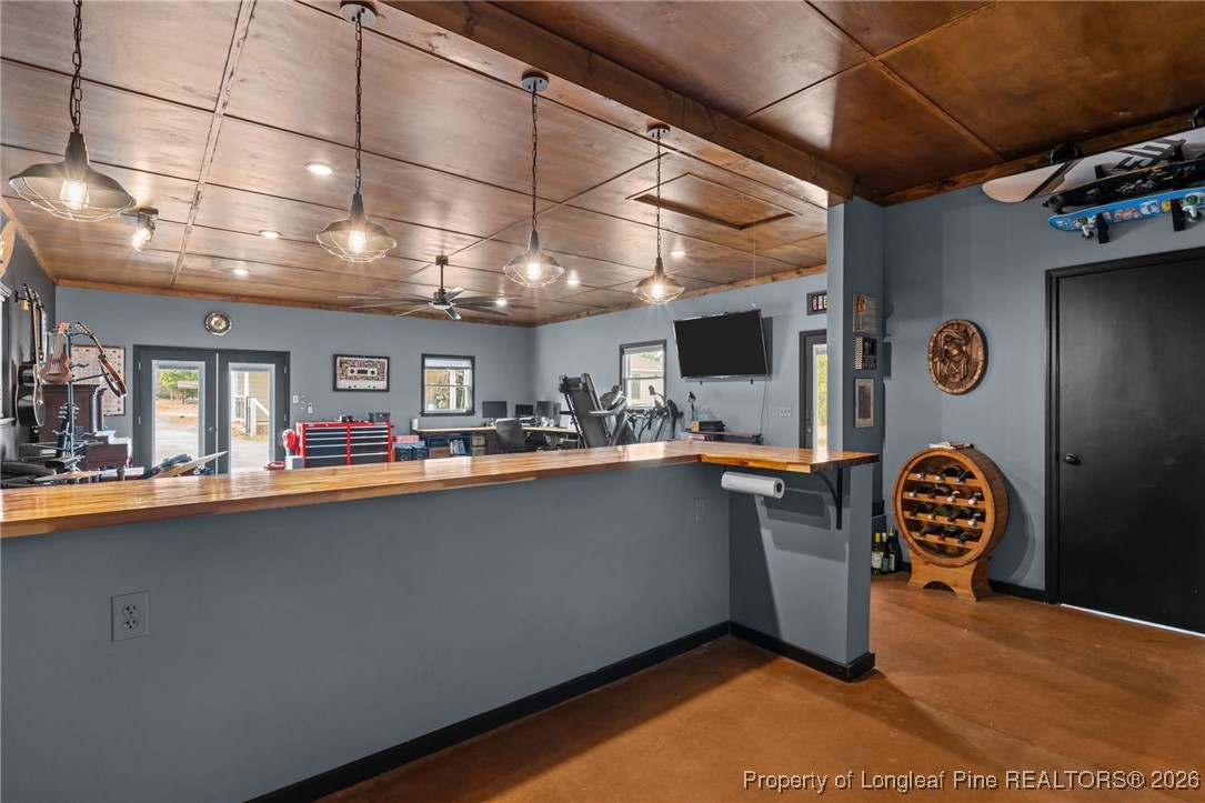 2229 Tingen Road Lillington, NC 27546 - Photo 38 of 50 a kitchen with stainless steel appliances granite countertop a sink a counter space and cabinets