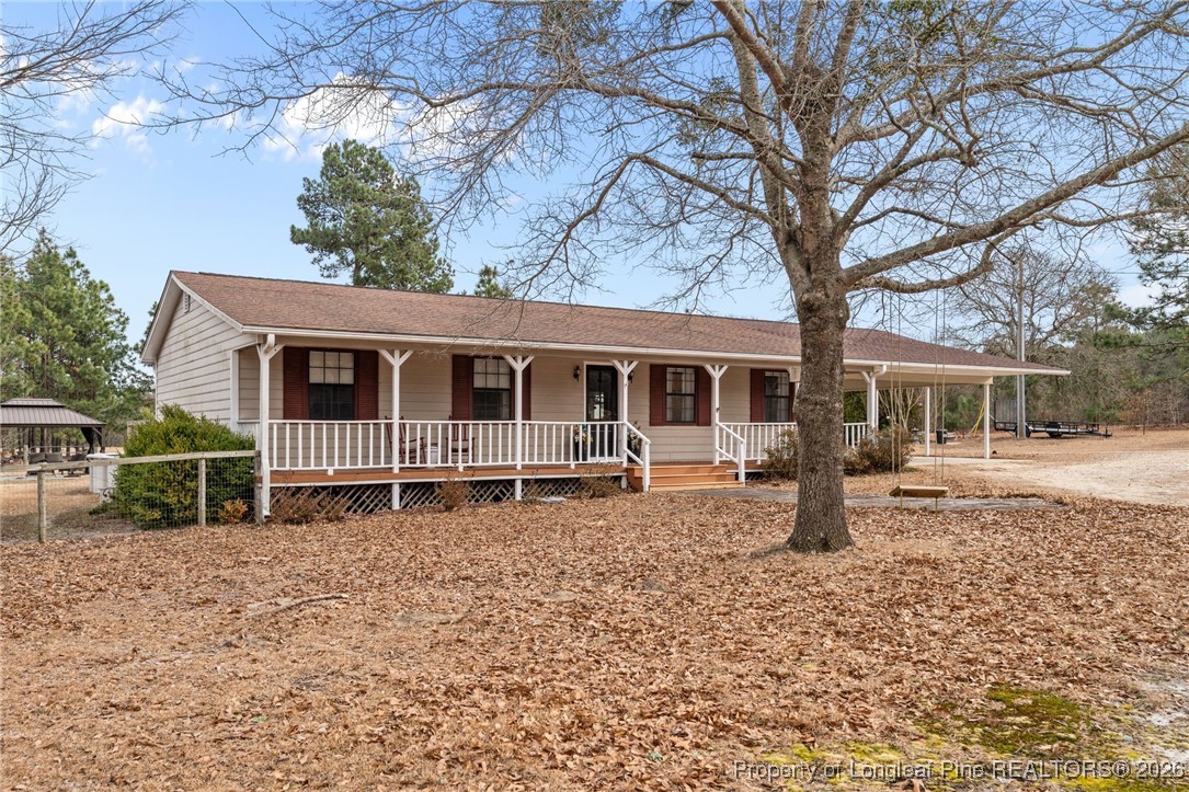 2229 Tingen Road Lillington, NC 27546 - Photo 40 of 50 a house with trees in the background