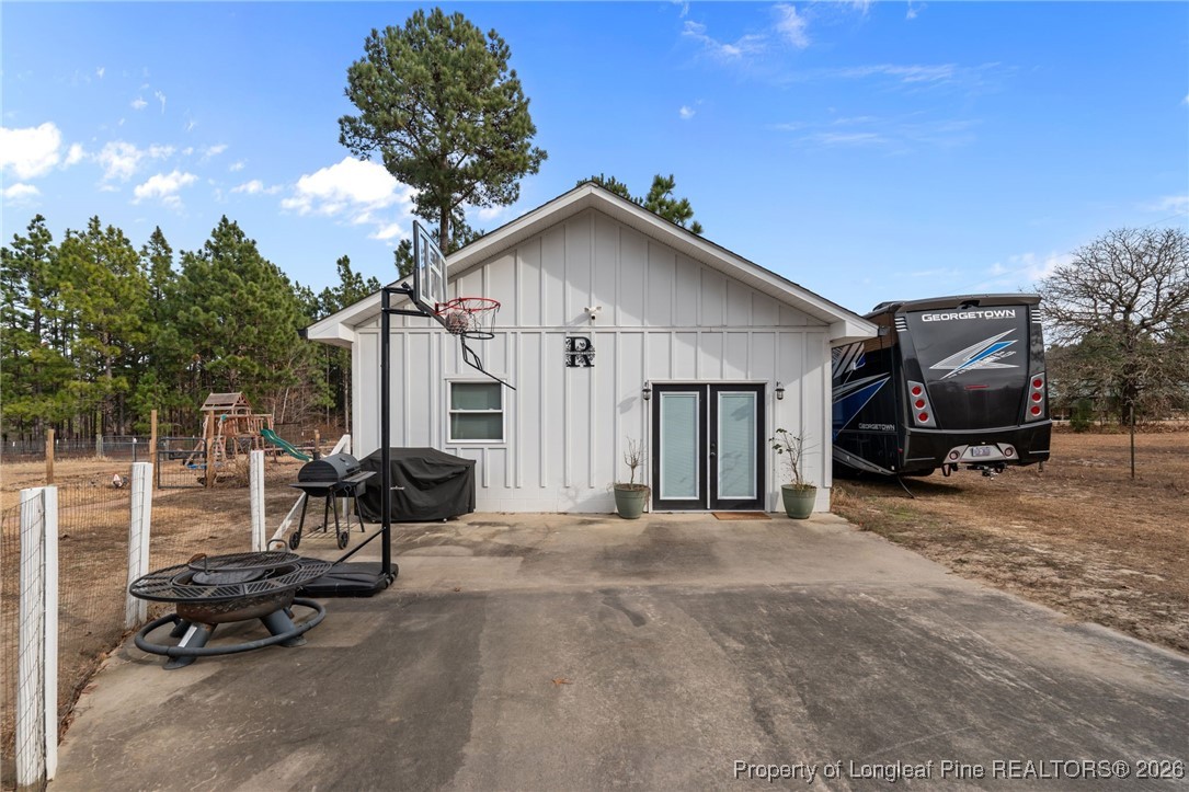2229 Tingen Road Lillington, NC 27546 - Photo 44 of 50 a view of a house with backyard and a trees