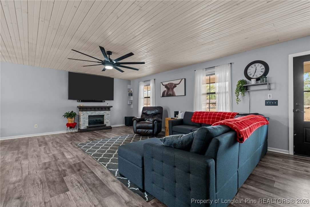 2229 Tingen Road Lillington, NC 27546 - Photo 10 of 50 a living room with furniture a window and a flat screen tv