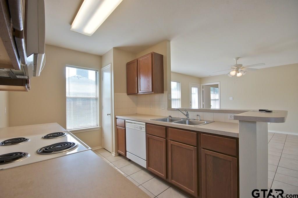 623 Hagan Road Whitehouse, TX 75791 - Photo 8 of 28 a kitchen with a sink stove and cabinets