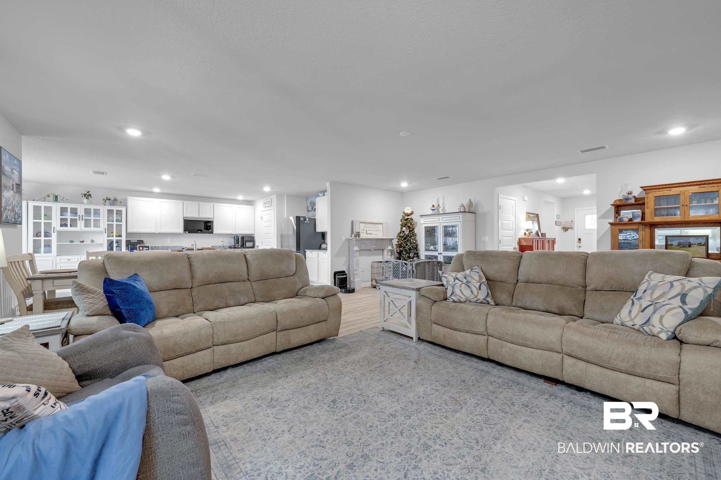 24271 Ringneck Loop Elberta, AL 36530 - Photo 6 of 44 Open-concept living area featuring light wood-finish flooring, recessed lighting, and a neutral color palette