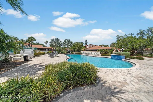 a view of a swimming pool with a patio