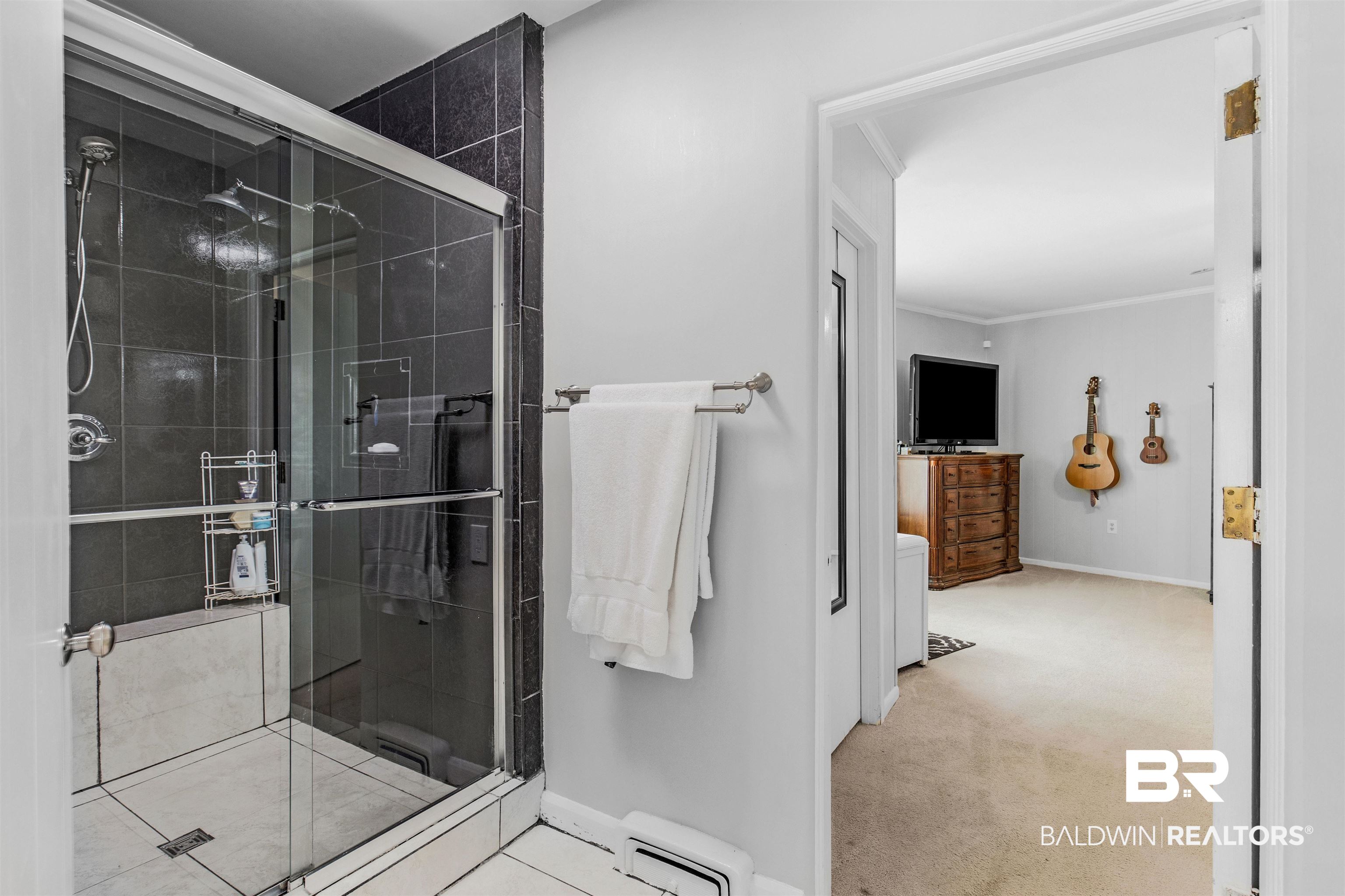 4306 Michael Boulevard Mobile, AL 36609 - Photo 17 of 35 Bathroom with walk in shower and crown molding