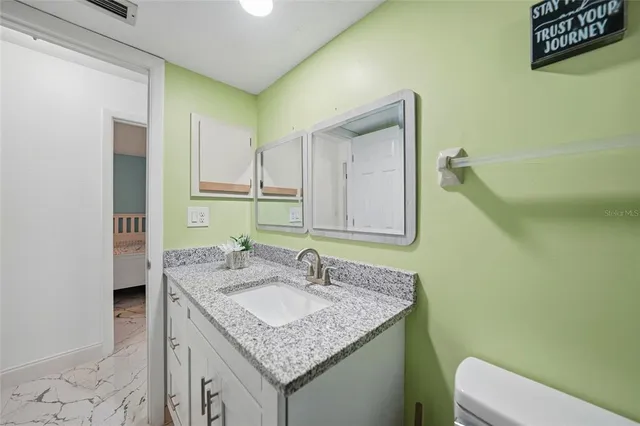 a bedroom with bed and window