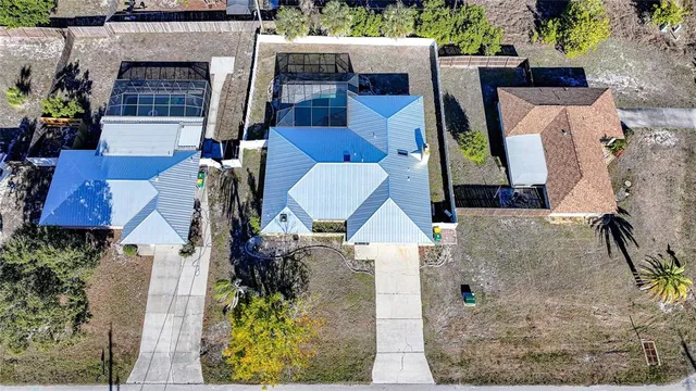 an aerial view of residential houses with outdoor space