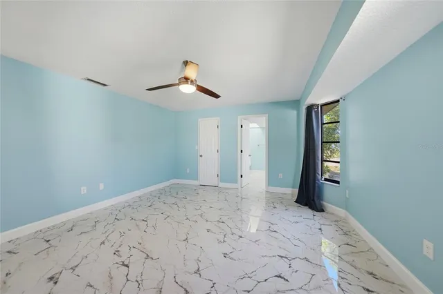 a view of a livingroom with a ceiling fan