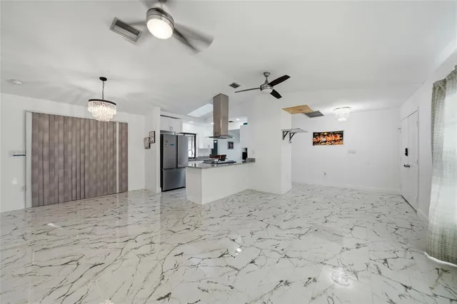 a view of a kitchen with furniture and a window
