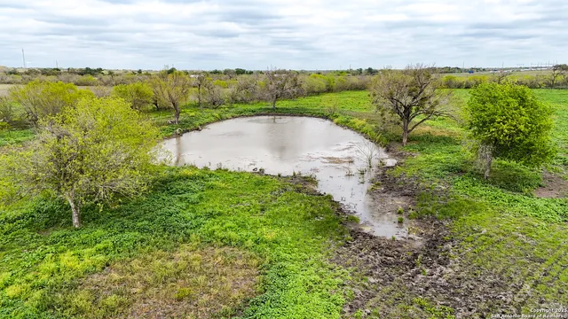 a view of a lake with a yard