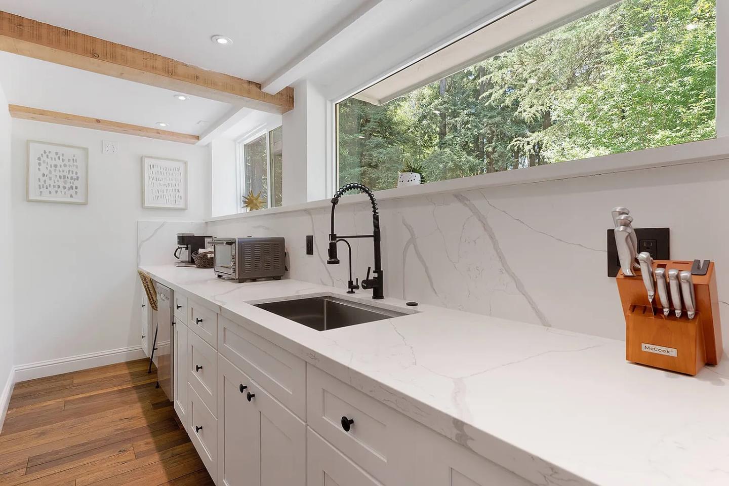 1003 Laurel Glen Road Soquel, CA 95073 - Photo 44 of 101 a kitchen with stainless steel appliances granite countertop a sink and a wooden floor
